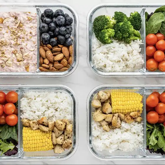 Meal prep containers with rice, chicken, corn and vegetables